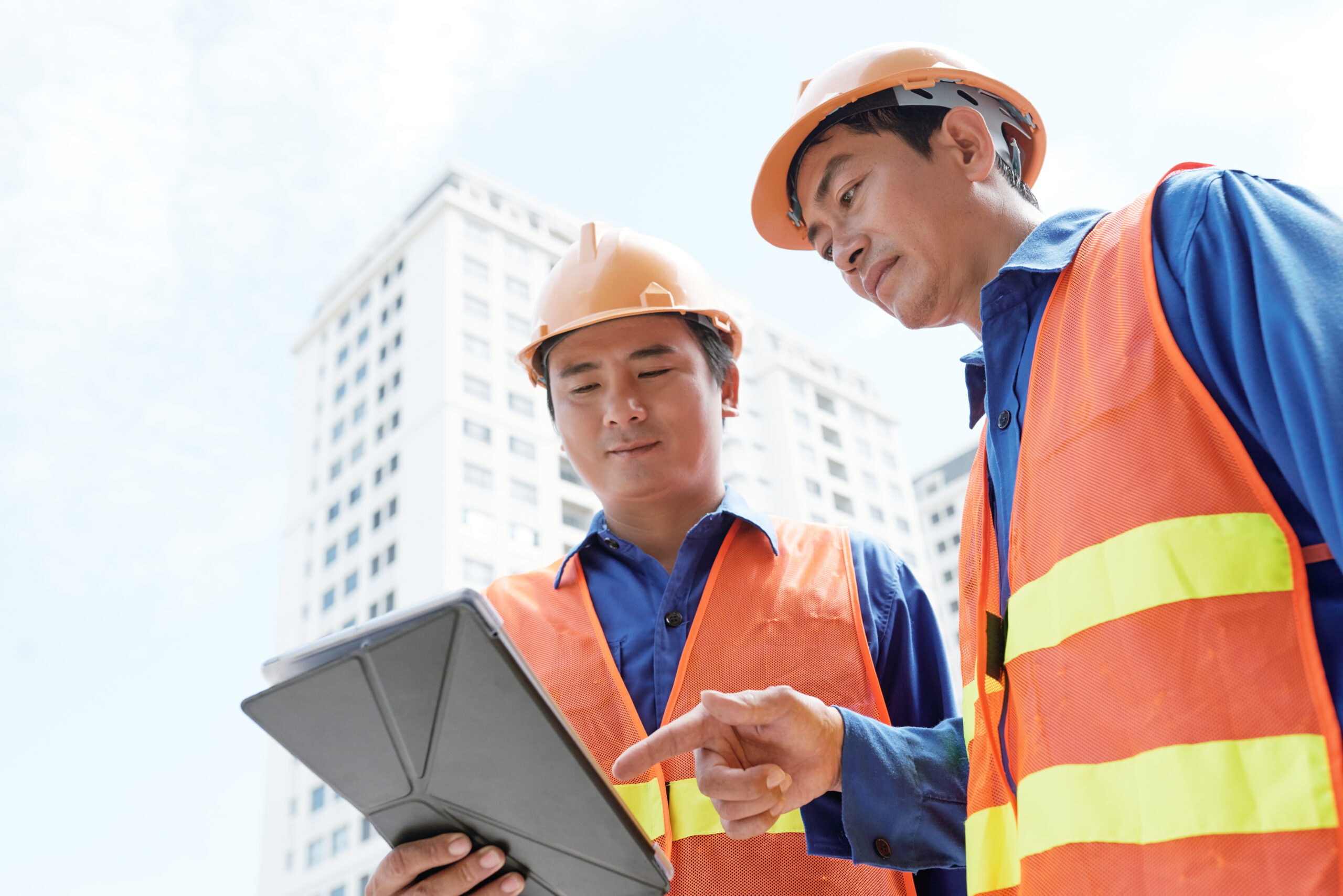 engineers analyzing data digital tablet scaled